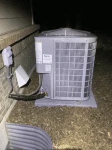 Side view of air conditioner installation with electrical and refrigerant connections Castle Rock CO
