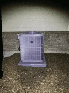 Newly installed air conditioner unit outside home in Castle Rock CO at night