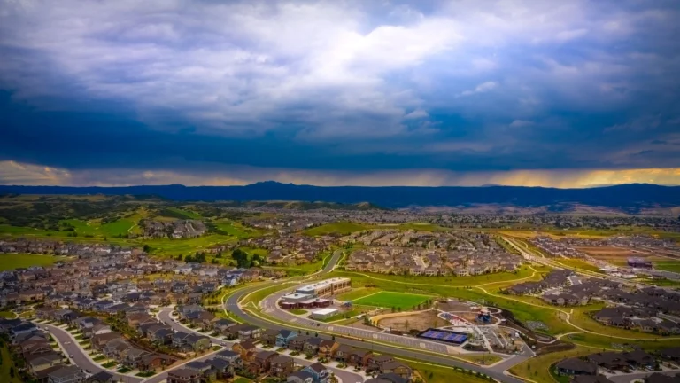 Castle Rock Colorado with storm clouds above