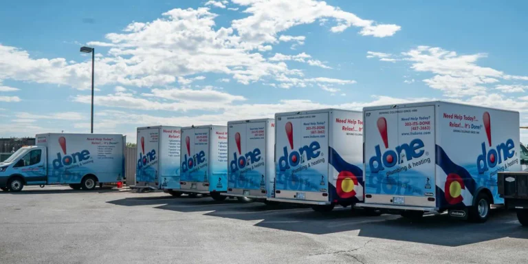 A fleet of Done trucks parked