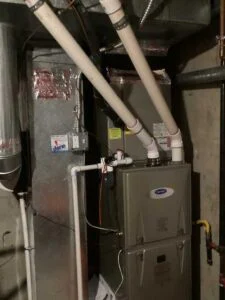 New Carrier gas furnace installed in basement during HVAC replacement