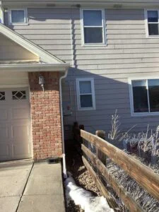 Finished exterior electrical line routing from panel to HVAC equipment in Castle Rock home