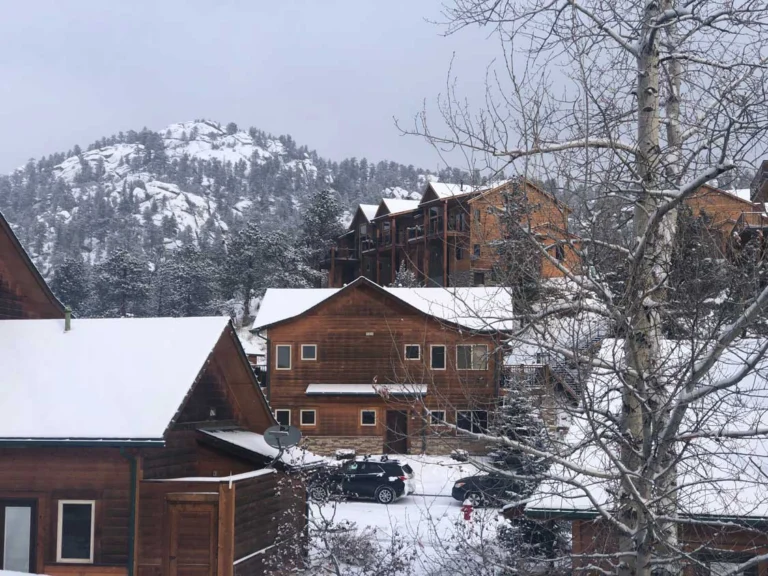 Rocky Mountain cabins covered in snow