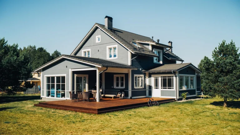 Model home on a sunny day in a rural area with grass and trees