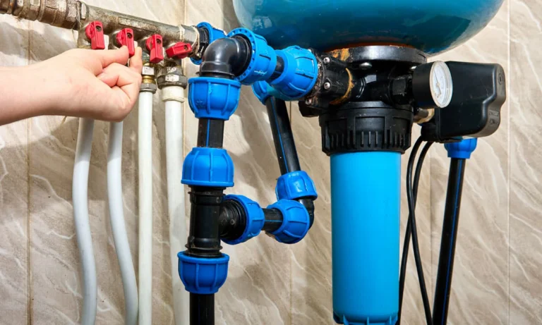 Someone adjusting the water flow to a home water filtration system