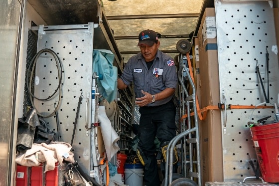 A Done technician gathering tools from his truck