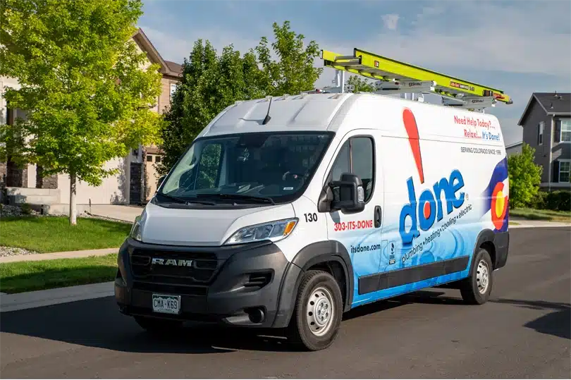 The Done Plumbing, Heating, Cooling, & Electric van parked on a street