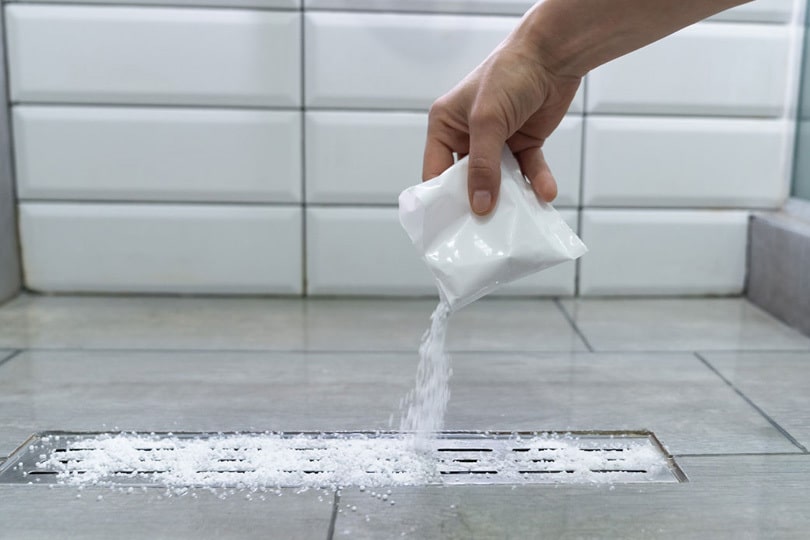 Pouring cleaning agent down a drain