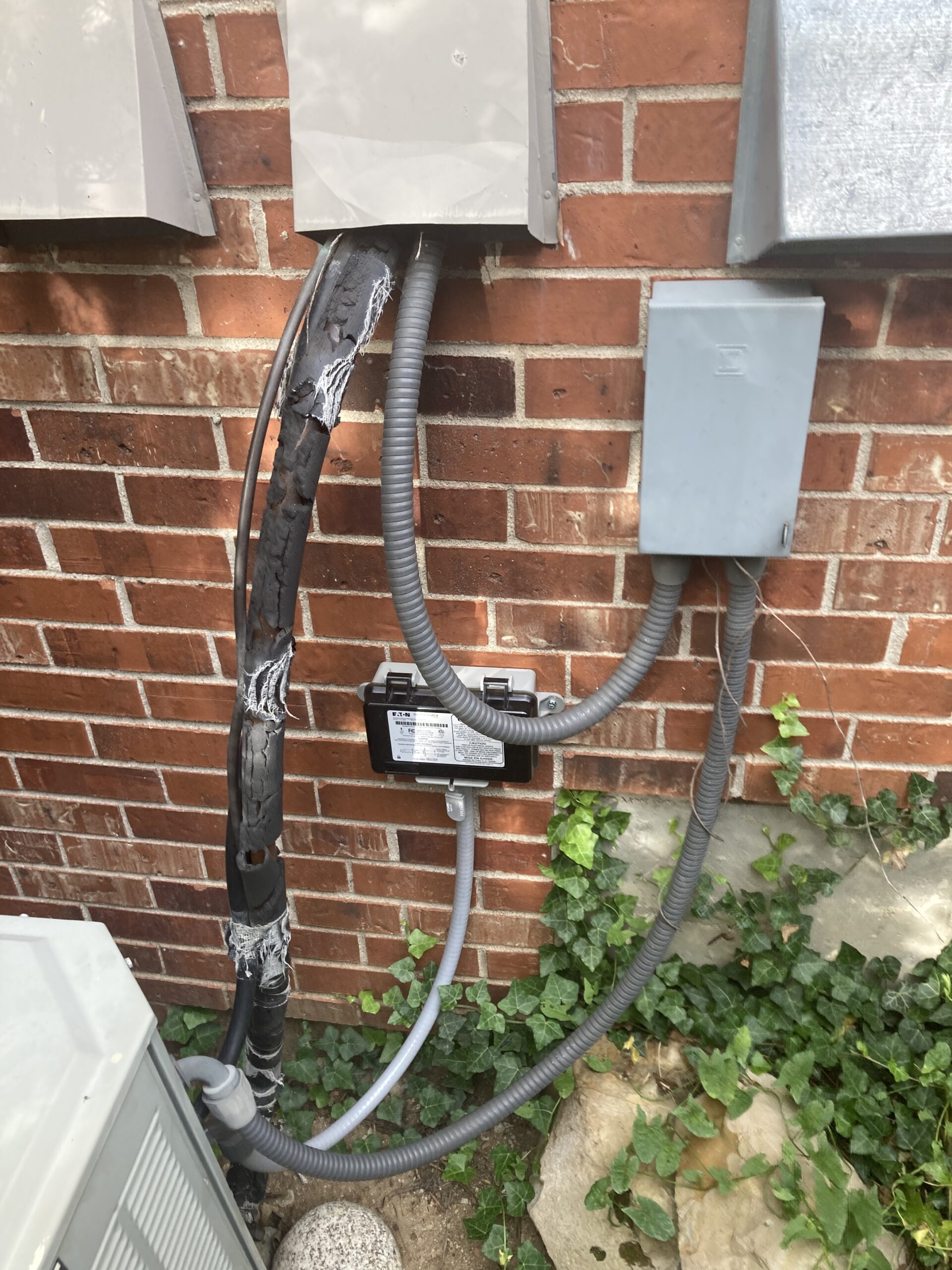 An electrical panel that needs to be repaired outside a home