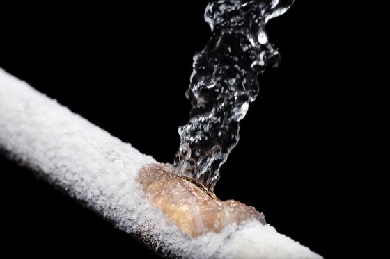 A frozen pipe with water leaking