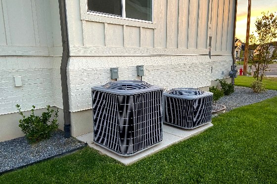 A dual A/C unit installed outside a home