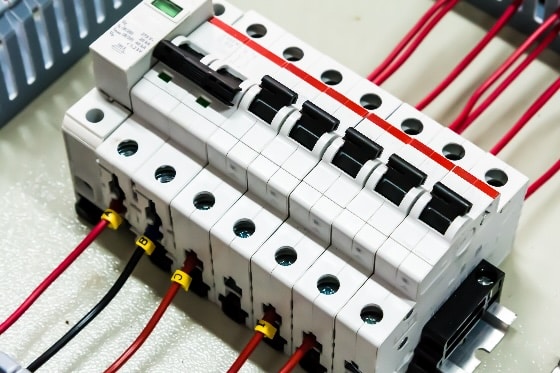 Up close stock photo of a circuit breaker for surge protections in a home