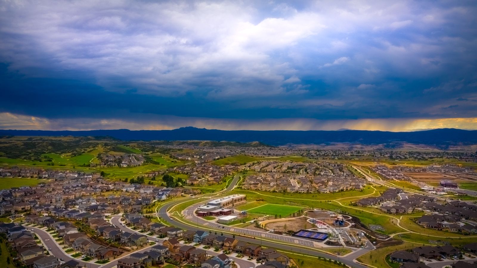 Castle Rock Colorado with storm clouds above