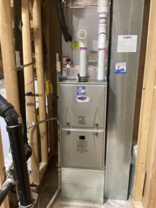 outdoor HVAC unit installed next to home with proper spacing and connections