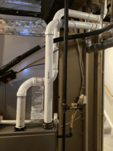 PVC vent piping connected to furnace system during installation Thornton CO