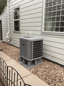 Heat pump outdoor unit installed beside home in Thornton CO