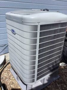 Carrier heat pump installed outside home in Littleton CO