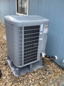 New outdoor heat pump installed on a stable pad, ready to provide energy-efficient heating and cooling year-round.