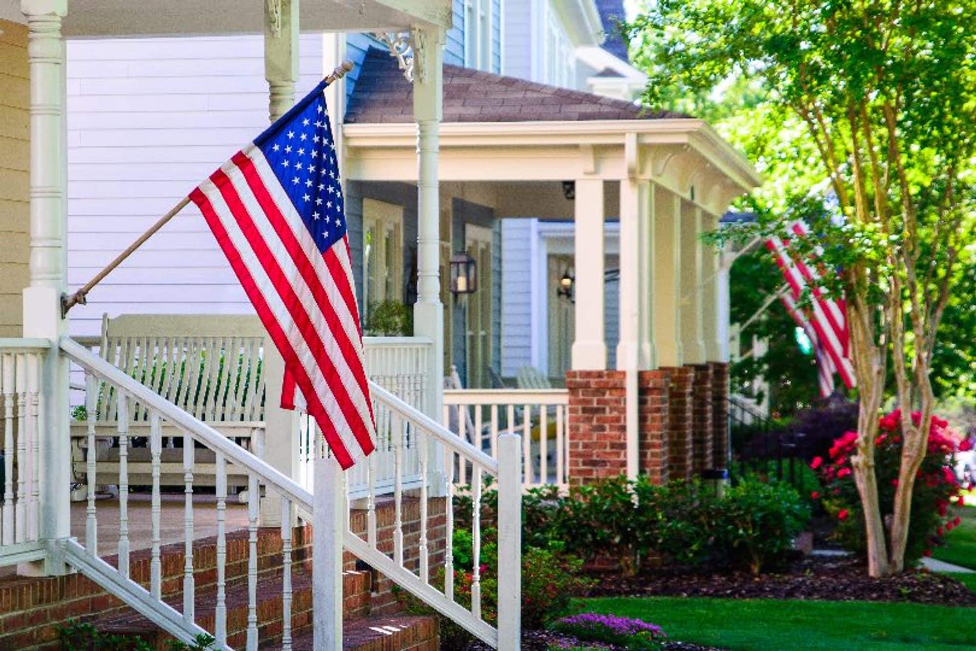 American flags being flown outside homes
