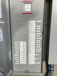 Opened Leviton box showing marked circuit breakers