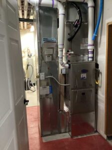 New Carrier Infinity gas furnace and evaporator coil installed during full HVAC installation in Thornton CO