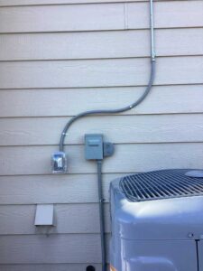 Dedicated HVAC electrical circuit and disconnect installed near outdoor air conditioning unit