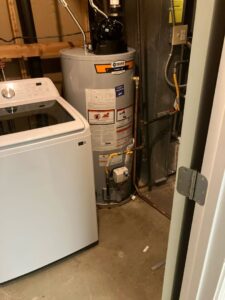 A newly installed water heater in a basement in a home in Aurora, CO