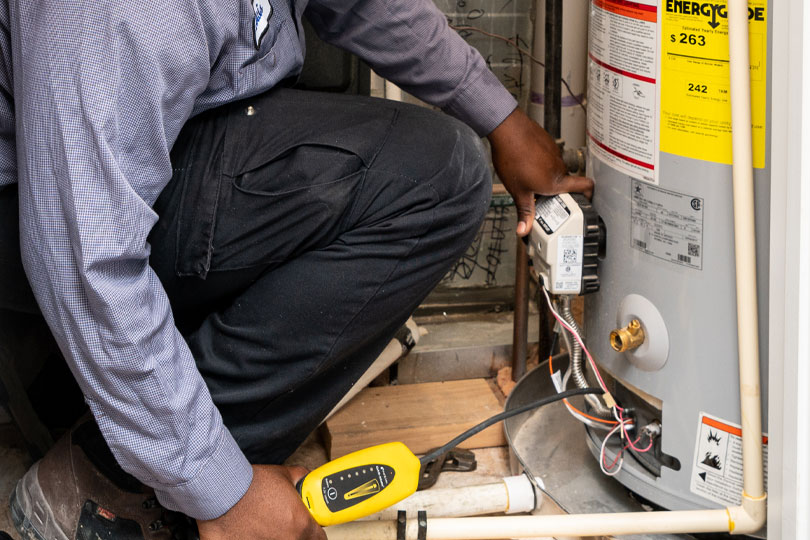 Denver plumber conducts a water heater flush