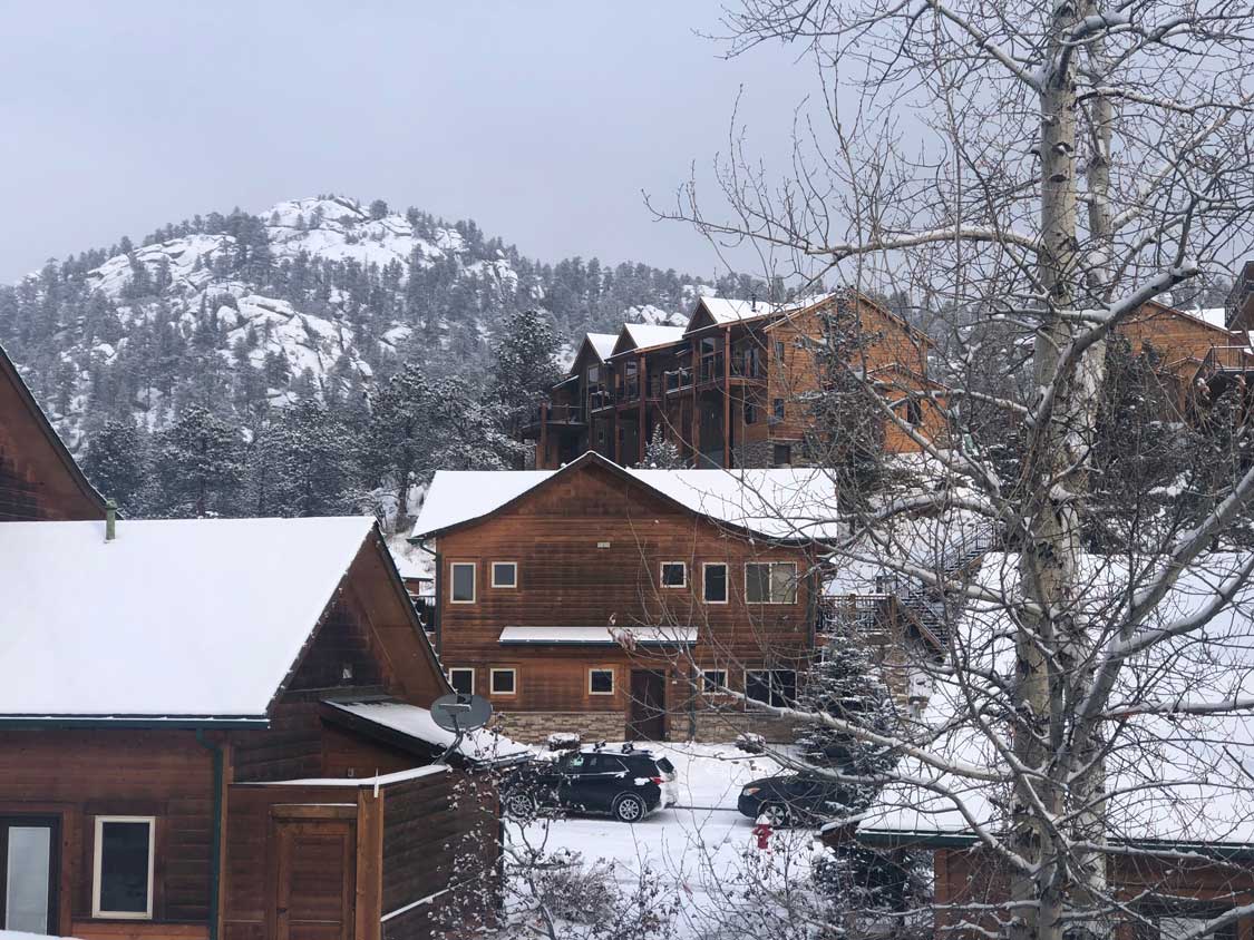 Rocky Mountain cabins covered in snow