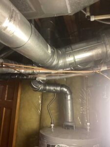 HVAC venting and ductwork installed above furnace during Centennial HVAC installation